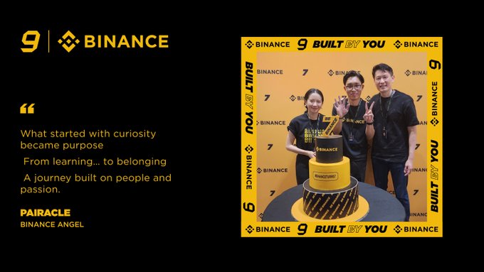 **PAIRACLE** and two colleagues celebrate Binance's 9th anniversary beside a tiered "Built By You" cake, with the quote "What started with curiosity became purpose. From learning… to belonging — a journey built on people and passion" — capturing the post's message of his five-plus years growing from a curious learner into part of Binance's global family.
