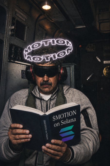 A man wearing headphones and a neon "MOTION MOTION" headpiece reads a book titled "$MOTION on Solana" featuring the Solana logo.