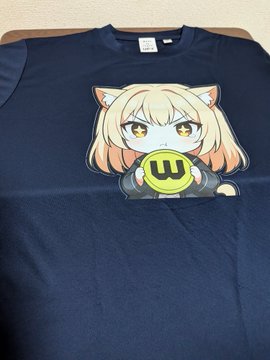 A navy blue t-shirt features an anime-style chibi cat character with blonde hair blowing a yellow bubble with a 'w' on it.