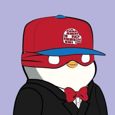 A cartoon penguin wearing a red and blue cap, red domino mask, and a tuxedo with a red bow tie.