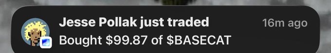 The image shows a notification from a wallet or trading app indicating that Jesse Pollak just bought $99.87 of $BASECAT, timestamped 16 minutes ago, providing real-world validation of the post's claim that $BASECAT activity is picking up.