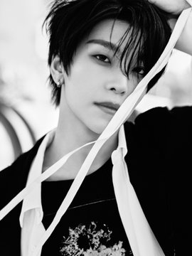A black-and-white portrait of a young person with short dark hair and a black top, accented by white ribbons draped across their face, creating a moody, nostalgic aesthetic that complements the post's reflection on "alpha times."