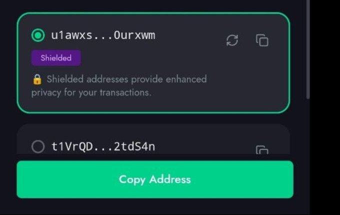 A crypto wallet interface showing a 'Shielded' address 'u1awxs...0urxwm' with the message 'Shielded addresses provide enhanced privacy for your transactions,' and a green 'Copy Address' button.