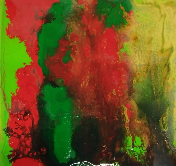 An abstract artwork titled **“Like a Phoenix”** bursts with vivid red, green, and yellow forms emerging from deep black and shadow, visually echoing the post’s description of quiet splendor rising “from the darkness.”
