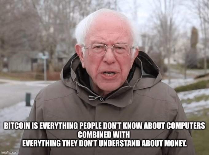 A meme image of Bernie Sanders wearing a winter coat with the caption 'BITCOIN IS EVERYTHING PEOPLE DON'T KNOW ABOUT COMPUTERS COMBINED WITH EVERYTHING THEY DON'T UNDERSTAND ABOUT MONEY.'