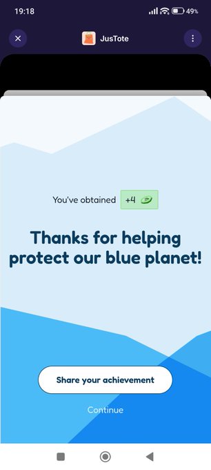 The image shows a phone screen displaying an app called "JustoteDAO" with a message that says, "You've obtained +4 points for helping protect our blue planet!". The app has a green button labeled "Thank yous for helping protect our blue planet!" and is accompanied by a small picture of a mountain.
