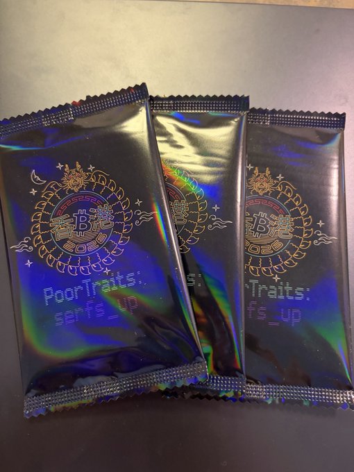 Three holographic black packets labeled with a 'B' logo and the text 'PoorTraits: serious' and 'Traits: angry' are displayed side by side.