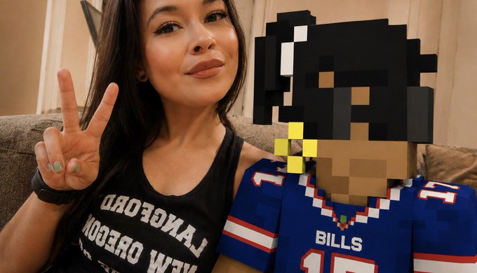 A woman in a black 'NEW ORLEANS' tank top makes a peace sign next to a child in a Buffalo Bills jersey, with the child's face pixelated.
