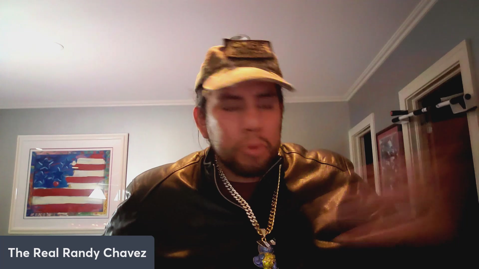 The image features a man wearing a hat, a leather jacket, and a necklace with a pendant that says "VeVe". The man appears to be making a funny face or gesture as he looks at the camera. The caption of the image reads "VeVe has 50k people for last drop! $OMI Dacat news!" which is related to the post about the man's funny expression and the hashtag "#VeVe".