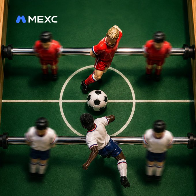 A tabletop foosball match featuring miniature players in red and white kits competing on a green pitch with a soccer ball at the center, branded with the MEXC logo in the upper left corner, promoting a giveaway to guess the score of the Norway vs England match.