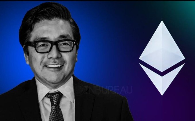 The image features a man wearing glasses and a suit standing against a blue background with an Ethereum logo in the center. The man appears to be smiling, possibly posing for a photo or video. The text "Hello guys I had Just been thinking about this BitMine ETH purchase for a minute." is also present in the image.