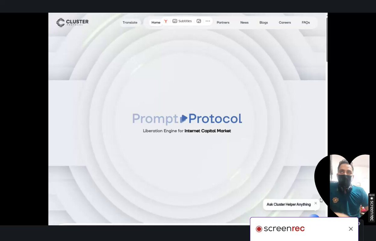 The image shows a person wearing a face mask sitting at a computer screen with a prompt for Protocol Protocol displayed on the screen. The person appears to be engaged in an online meeting or presentation, possibly discussing the benefits of using ClusterProtocol for building decentralized applications.