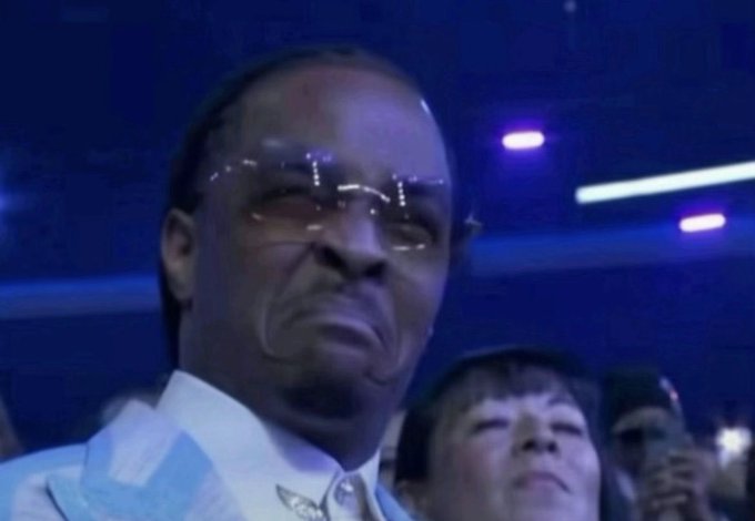 Reaction meme featuring an older man with glasses and a skeptical expression in a dimly lit venue with purple lights, a known widely-used internet reaction image.