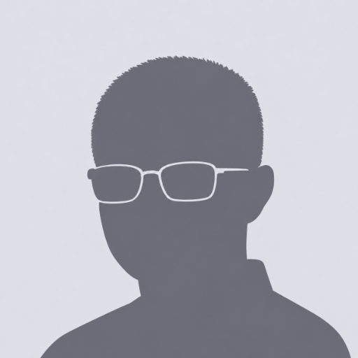 A generic grey silhouette avatar of a man wearing glasses against a light grey background.