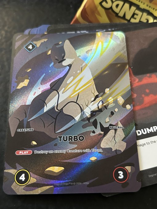 A holographic trading card from a collectible card game featuring the character Turbo, a creature with the ability to destroy an enemy creature with Trample, showing stats 4 and 3.