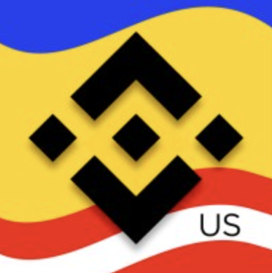 The image shows the Binance US logo with its characteristic black diamond design set against yellow, blue, and red wavy stripes, with the letters "US" visible in the bottom right corner. The accompanying post calls for BinanceUS to list Terra Classic ($LUNC), directly connecting the displayed exchange logo to the petition for a new cryptocurrency listing.