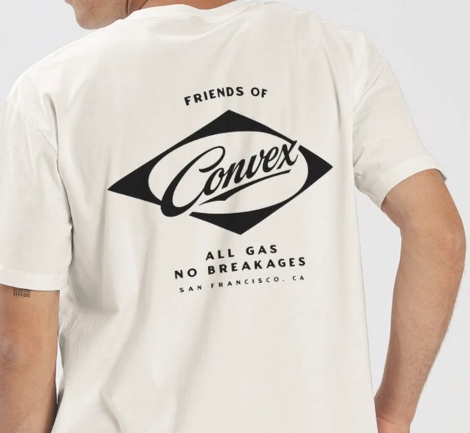 The back of a cream-colored T-shirt features a bold black logo reading "FRIENDS OF Convex" with "ALL GAS NO BREAKAGES - SAN FRANCISCO, CA" printed below. The custom shirt, designed by @existentializzm, is shown on a person to showcase the Friends of Convex apparel shared with group members.