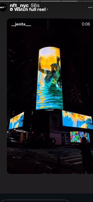 A nighttime photo of a large illuminated digital billboard displaying colorful animated artwork in what appears to be a city street setting, with the Instagram reel caption 'nft_nyc 56s' visible.