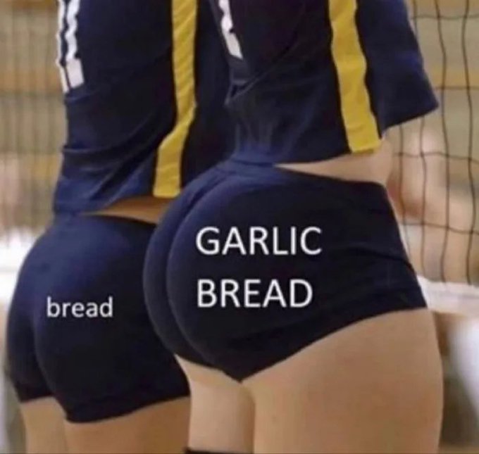 A meme showing two people in athletic uniforms from behind, labeled 'bread' and 'GARLIC BREAD', humorously implying the appearance of a loaf of garlic bread.