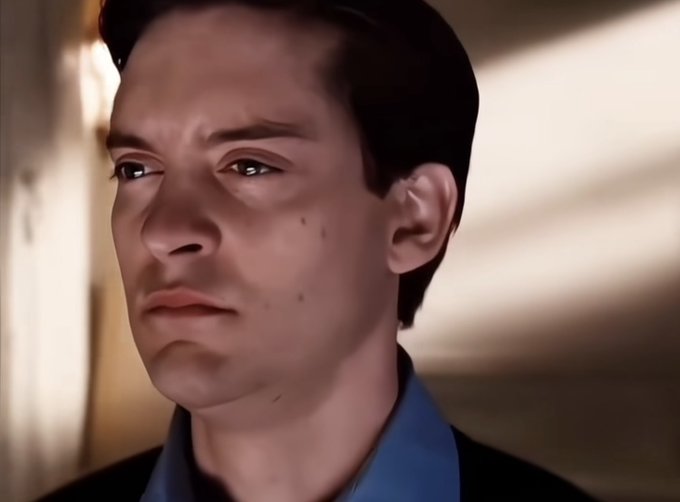 A close-up digital painting or 3D render of an Asian man's face with a serious expression, wearing a blue collared shirt against a softly lit background.