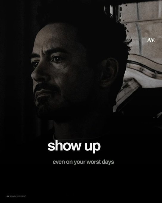 A dark, moody motivational poster features a profile shot of Tony Stark (Robert Downey Jr.) with the text 'show up even on your worst days' and the watermark 'AV'.