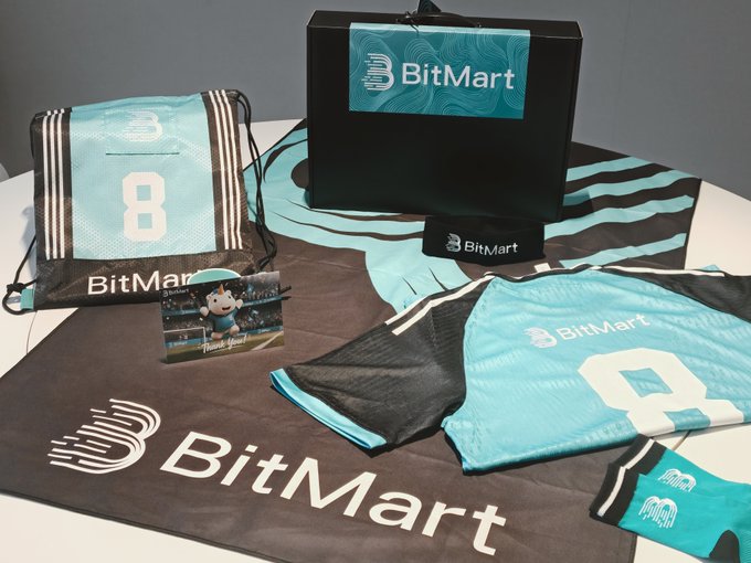 This image displays a collection of out-of-print BitMart merchandise, including shirts, socks, a bag, a box, and a banner, all branded with the BitMart logo and a sporty design featuring the number 8. The post announces a giveaway draw for this unique merch.