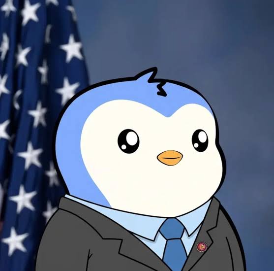 An animated illustration of a blue and white penguin character dressed in a black suit and blue tie, standing in front of an American flag.
