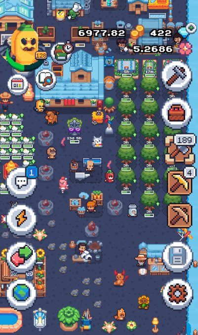 A screenshot of a pixel art mobile game showing a top-down view of a village with various characters, buildings, crops, and UI elements displaying numbers like "6977.82" and "422."
