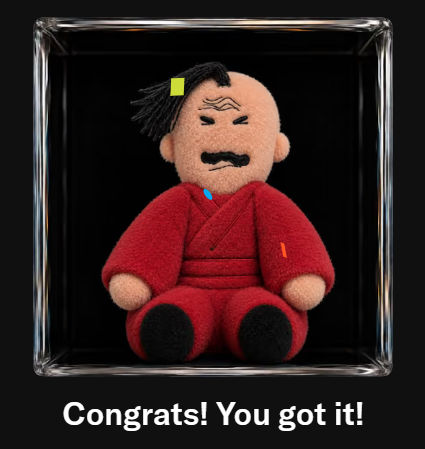A small plush doll of a mustachioed man in a red robe sits inside a clear display box with the caption 'Congrats! You got it!'