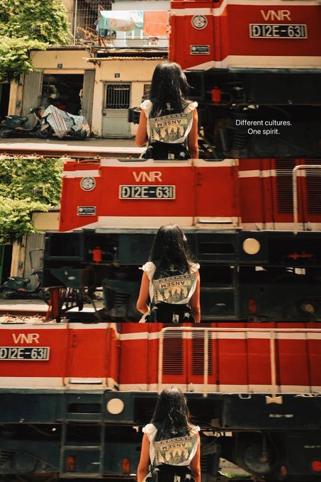 A three-panel collage shows a woman in a 'MJSNV' top walking past a red locomotive numbered 'D12E-631', accompanied by the text 'Different cultures. One spirit.'