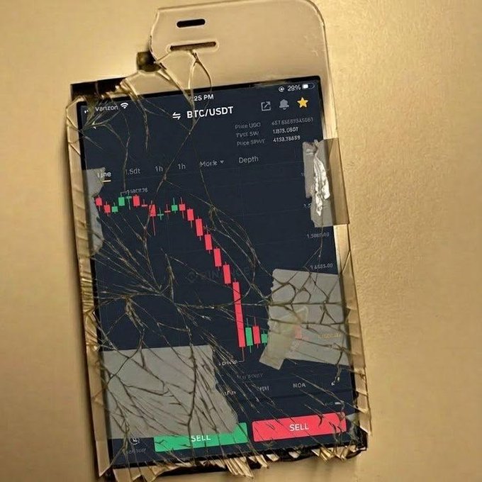 A shattered phone display shows a BTC/USDT trading chart with prices around $4,153, depicting a steep bearish candlestick pattern — humorously framed as an archaeological artifact from a crypto trader's 2016 portfolio.