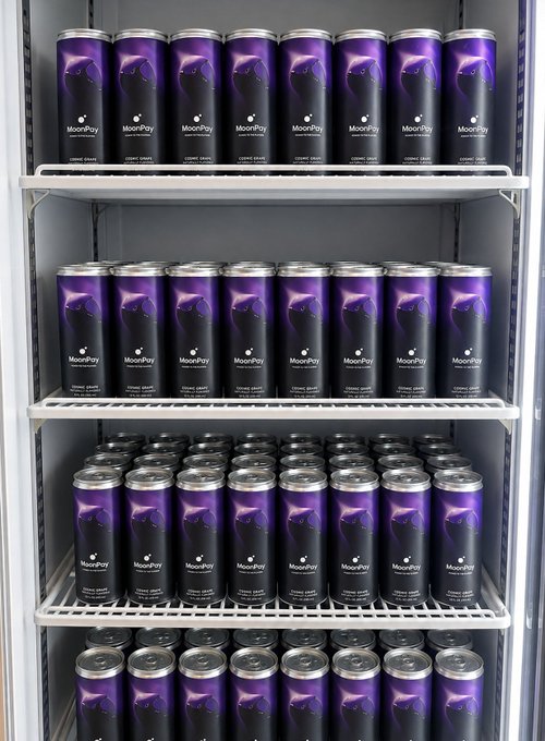 A refrigerator stocked with rows of purple MoonPay-branded energy drink cans, featuring the company's logo and "MoonPay" text, ready to fuel SuperteamUSA with love from the crypto payment platform.