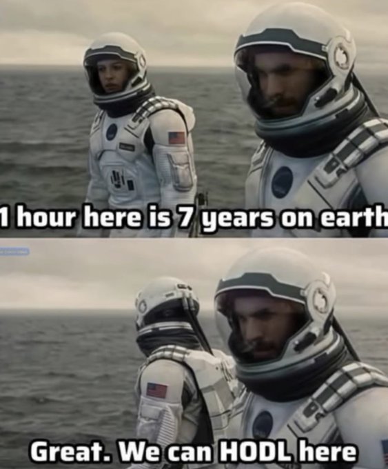 Two astronauts in white spacesuits stand by the ocean, with text reading "1 hour here is 7 years on earth" and "Great. We can HODL here," referencing the Interstellar film scene and crypto slang for holding investments long-term.