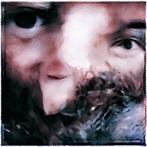 A heavily filtered, blurry close-up of a person's face with a vibrating or distorted visual effect applied.