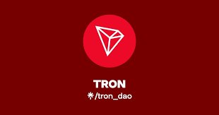 A TRON DAO logo appears against a dark red background, featuring the text "TRON" and the handle "@tron_dao" beneath the project's signature diamond emblem. The branding aligns with the accompanying post discussing TRON's briefing on the JST token's governance role and recent $1B market cap milestone.