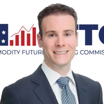 A professionally dressed man in a suit and striped tie stands in front of a backdrop displaying the "CFTC" logo (Commodity Futures Trading Commission) alongside a bar chart graphic, visually reinforcing the post's announcement about the CFTC releasing updated FAQs regarding crypto assets and blockchain technologies.
