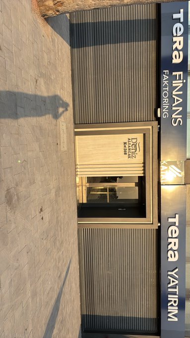 The image shows the exterior of a Tera Finans Faktoring building, with the company name displayed prominently on the facade. The accompanying #TERA hashtag refers to Tera Yatırım Menkul Değerler, which appears to be a related financial services entity in the same building.