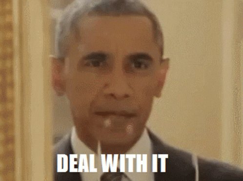 The image features a man wearing a suit, with his face clearly visible against a white background. The caption below the photo reads "Deal With It", which seems to be a reference to the current political climate or an advertisement for a product. The text also mentions that the man is wearing a tie and has a serious expression on his face.