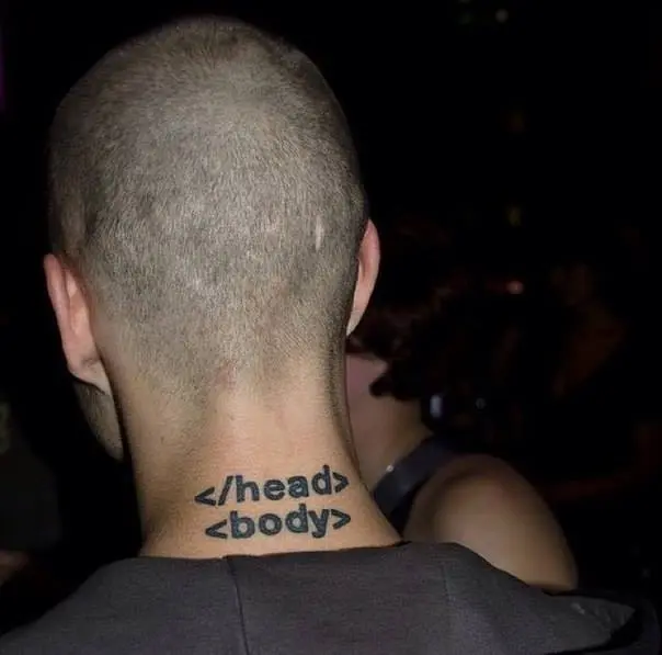 A man with a freshly shaved head shows off a neck tattoo of HTML closing tags "</head>" and "<body>" stacked on two lines.