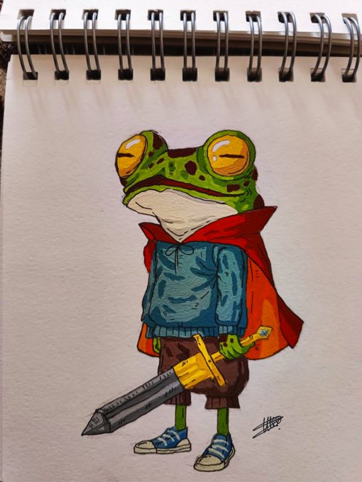A hand-drawn illustration in a sketchbook of a frog character dressed as a hero with a red cape, blue sweater, and holding a sword.