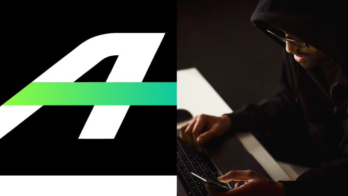 A hooded, glasses-wearing hacker is shown operating a laptop and holding a card in dim lighting, paired with the stylized "A" Arbitrum logo, visually representing the major AFX Trade exploit on the Arbitrum network that drained approximately $24.15 million in USDC.