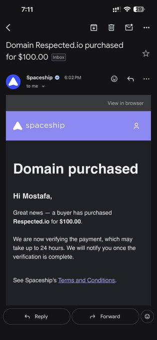 The image shows a dark green cell phone screen displaying a text message from an email service provider. The message reads, "Domain respectedio purchased for $100.00 inspected for 100.00 inclusive." The recipient of this email is mistakenly listed as someone named "Mostafa," leading to the mistaken assumption that MOSTAFRA is the actual name being sent out in this email. 

In addition to the email message and incorrect recipient, there are two other items on the cell phone screen: a social media app icon and an incoming call from someone with the name "MOSTAFRA." The phone is placed face down against a dark background.
