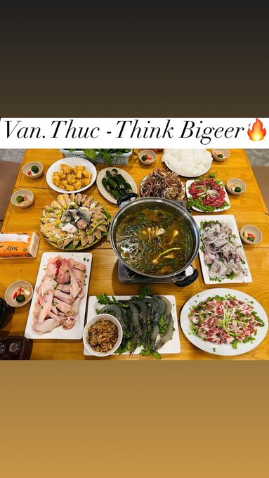 A Vietnamese feast spread including hotpot, raw beef, chicken, prawns, and various dishes, captioned 'Vạn.Thục -Think Bigeer' with a fire emoji.