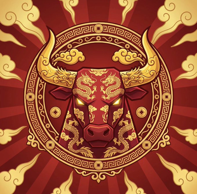 Decorative emblem featuring a red bull's head with golden dragons, surrounded by a circular Chinese-style border with clouds and coin motifs on a red sunburst background.