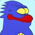 A simple 2D cartoon illustration of a blue hedgehog-like character with yellow eyes, a red nose/mouth area, and small spikes on its head against a light blue background.