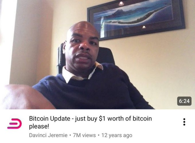 The image shows a YouTube thumbnail from Davinci Jeremie's video titled "Bitcoin Update - just buy $1 worth of bitcoin please!" posted 12 years ago with 7M views. The screenshot features him speaking to the camera, illustrating the post's point that even this early Bitcoin advocate, who once urged viewers to buy just $1 worth, reportedly later shilled scam coins rather than holding BTC.