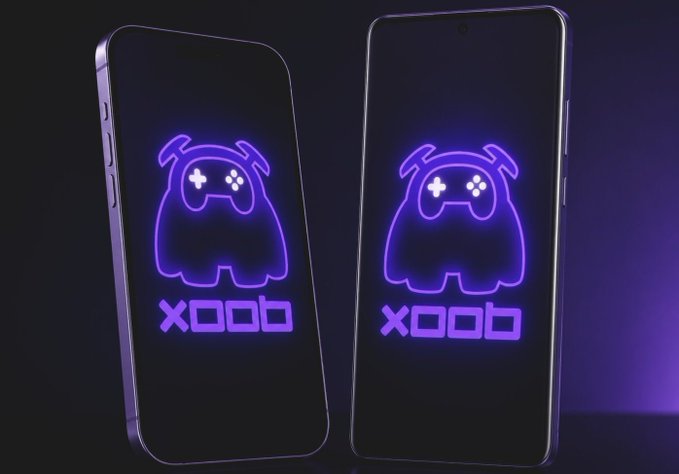The image features two cell phones, both of which are purple with a glowing green monster design on them. The phones are positioned side by side against a black background, creating a striking contrast between their colors and the dark backdrop. Below the phones, there is text that reads "Good Afternoon everyone. Today was very Busy day. But Don'T Forget To Post About @XOOBNetwork & @useTria". The combination of the purple cell phones with the green monster design and the accompanying text creates an interesting visual composition that draws attention to both the phones and the message they convey.

The image is likely related to a social media post or advertisement, as it features two phones and some text promoting a product or service. The use of vibrant colors for the cell phones and the green monster design adds a playful and eye-catching element to the overall composition.