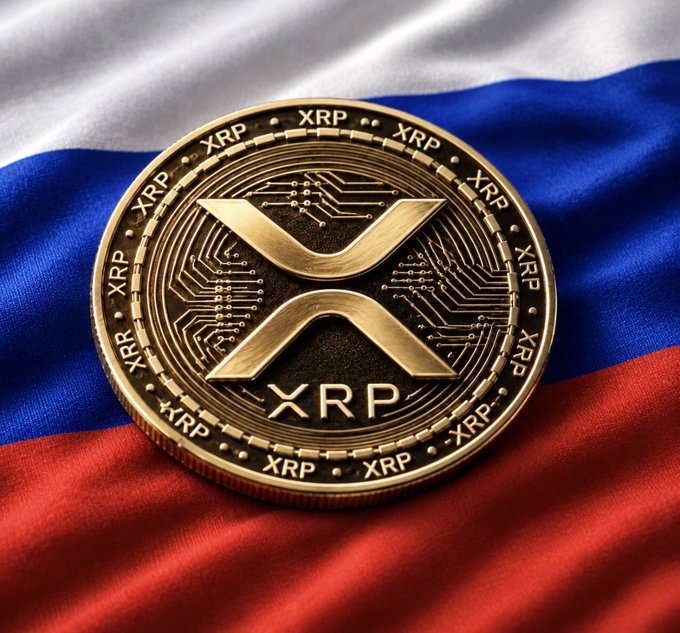 A gold XRP cryptocurrency coin resting on top of a Russian flag with white, blue, and red horizontal stripes.