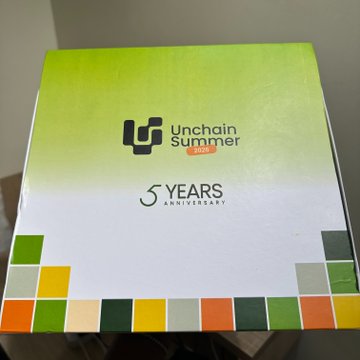 A green and white box labeled 'Unchain Summer' celebrating '5 Years Anniversary' with a colorful geometric border along the bottom.