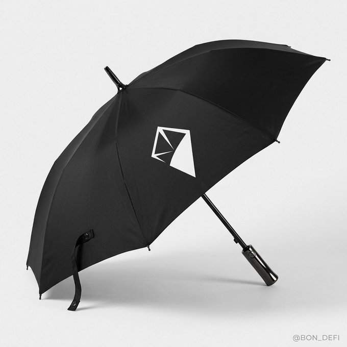 A sleek black umbrella featuring an enlarged branding logo of "GFC," "NFT," or "EFG" displayed on a panel, styled as a product shot with the watermark @BON_DEFI.